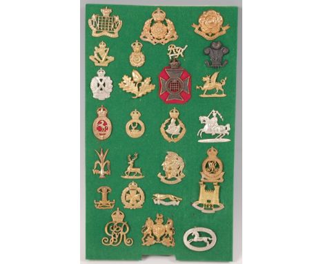 A collection of British Army cap badges and insignia, to include Welsh Horse Yeomanry, Loyal Suffolk Hussars (Duke of York's 