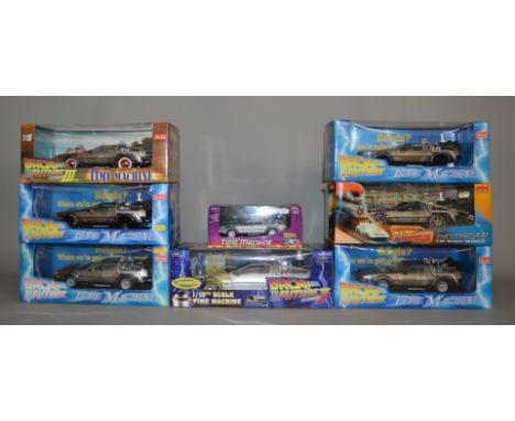6x Sunstar Back To The Future 1:18 scale diecast models together with a Diamond exaple and a 1:24 model, all boxed. (8)