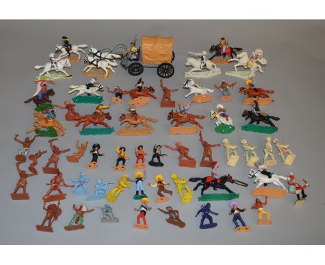 A quantity of vintage plastic 'Cowboys and Indians' plastic toy figures, mostly Timpo examples.