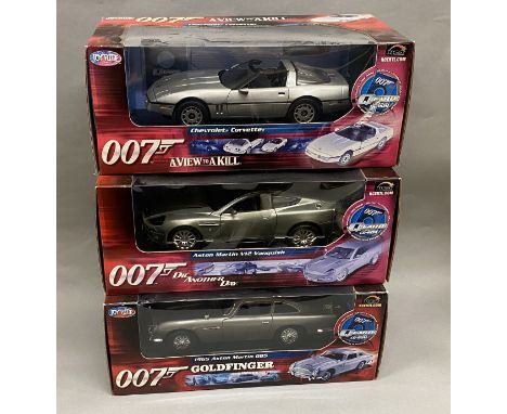 3x James Bond 007 1:18 Scale vehicle models by Joyride: Chevrolet Corvette, Aston Martin V12 Vanquish, Aston Martin DB5. All 