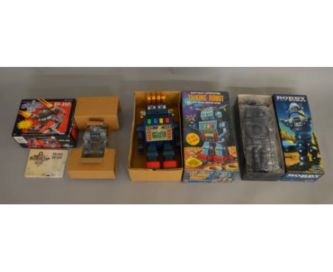 3x vintage robot figures including Robocop and Forbidden Planet examples, all bxoed.
