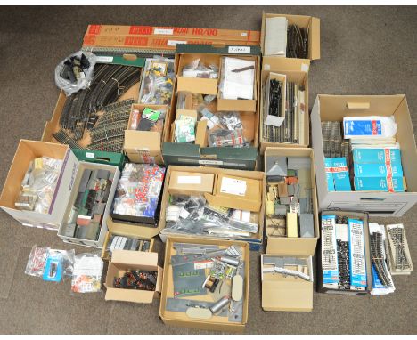 A large quantity of assorted model railway accessories including loose railway layout buildings together with a large quantit