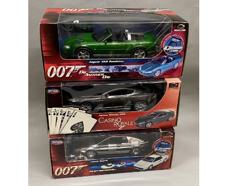 3x James Bond 007 1:18 Scale vehicle models by Joyride: Lotus Esprit, Jaguar XKR Roadster, Aston Martin DBS. All appear VG in