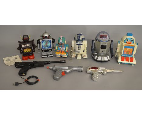 Quantity of unboxed vintage robot and sci-fi related robots and weapons.