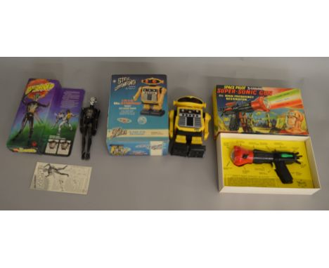 A Vintage Merit Space Pilot Super-Sonic Gun together with a Denys Fisher Android and Caprice Star Command Starlord robot, all