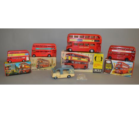 A selection of vintage boxed larger scale plastic London Bus models, all double deckers, including a Mettoy RT type model, a 