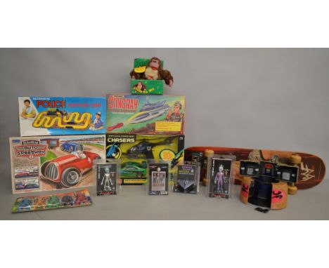 An interesting group of toys, mostly boxed and carded including a rare Tonka Batman Forever Chasers RC Car and Helicopter set