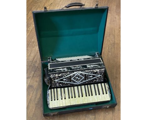 A cased Alvari Accordion