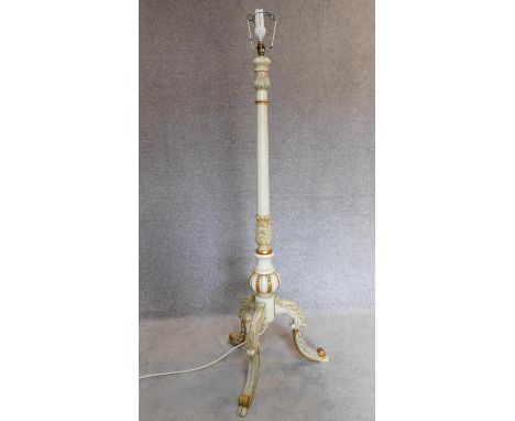 A painted French style standard lamp on tripod cabriole supports. H.160cm 