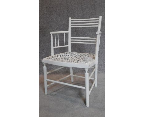 A late 19th century white painted stick back armchair in the William Morris style. H.80cm 