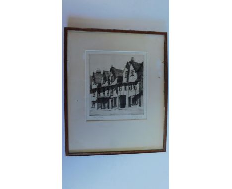 A framed and glazed etching, Norwich street. signed H. J. Starling. 46x38cm. 