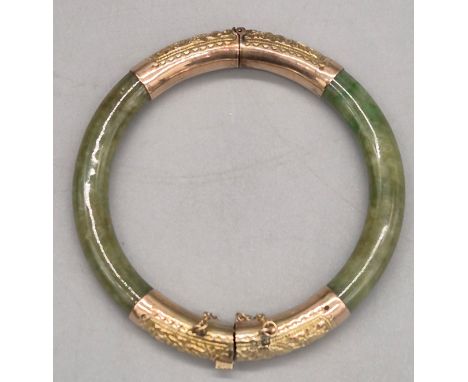 Antique Chinese 14ct yellow gold and jade bangle. Makers mark stamped to inside of link. 6.5cm diameter. 