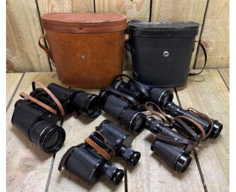 Four pairs of binoculars; Military Ross London binoculars, Zenith 7x50 Binoculars in fitted leather case, Hanimex 8x40 binocu