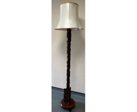 Carved Chinese standard lamp. 211cm in height including shade. 