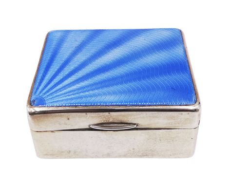 1930s silver mounted cigarette box, of rectangular form, with blue guilloche enamel sunburst decoration to hinged cover, open