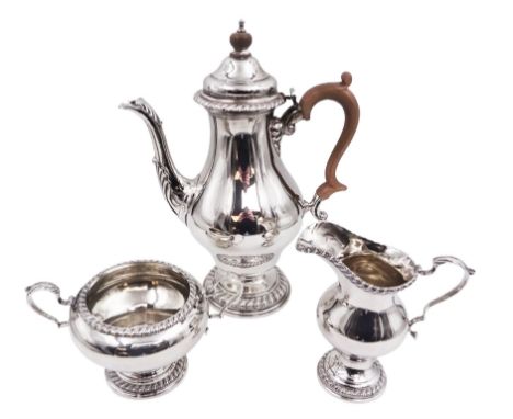 Mid 20th century three piece silver coffee service, comprising coffee pot, milk jug and twin handled open sucrier, of waisted