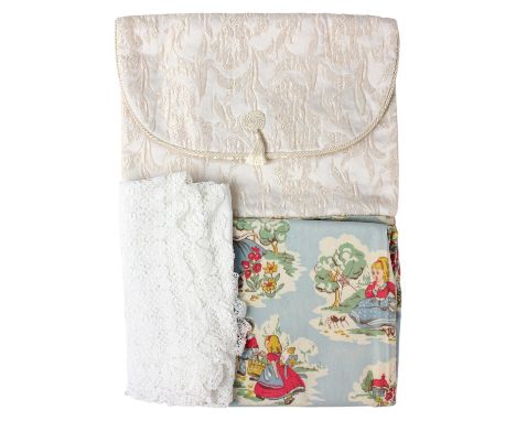 A small group of domestic textiles including a whitework linen tablecloth, a 1950s / 1960s printed cotton nursery curtain and
