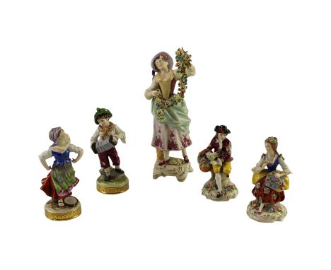 A pair of Oldest Volkstedt Porcelain figurines, respectively of a boy in rustic clothes playing a concertina, and a dancer wi