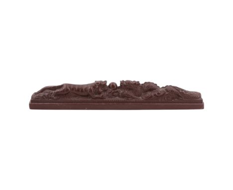 A Chinese scroll weight modelled as a dragon / Lóngzhū and tiger reaching for a central pearl, 22 cm x 2.5 cm x 4 cm 