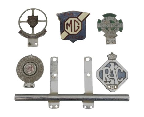 [ Classic car ] A chrome bumper bar together with Jaguar Drivers' Club, British Field Sports Society, MG Car Club, RAC and RA
