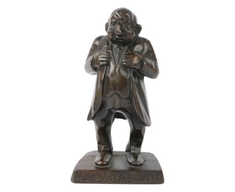 An early 20th Century anti-semetic bronzed iron caricature figure of a Jewish businessman, inscribed "Now! Vot about it?" and