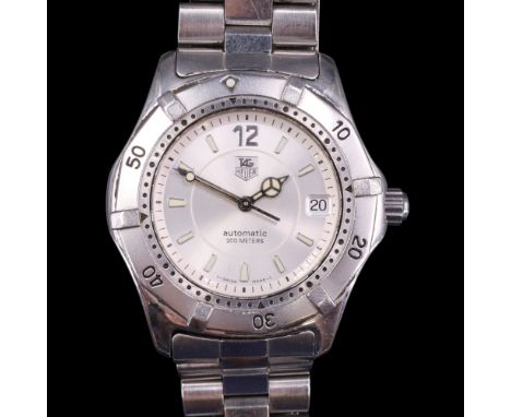 A TAG Heuer 2000 wristwatch, having an automatic movement and radially-brushed silver vase with luminous baton markers, Merce