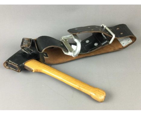 GERMAN FIREMAN'S BELT,the broad belt suspended with an axe, along with a helmet with German firebrigade paint work (2)