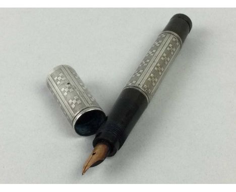 EARLY 20TH CENTURY WATERMAN'S FOUNTAIN PEN,circa 1920s, with engine turned line and cross pattern white metal overlay to the 