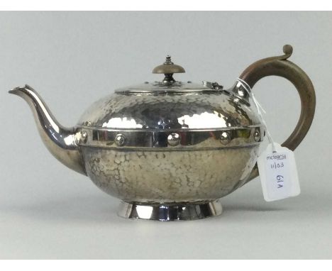 ARTS &amp; CRAFTS CELTIC INSPIRED THREE PIECE TEA SERVICE,comprising teapot, sugar and cream, with hammered decorationConditi