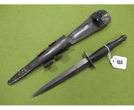Second Half XX Century Fairburn Sykes Fighting Knife, in leather scabbard. 