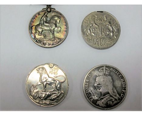 A WWI War Medal to 3/3382 PTE.C.Steade, Yorks Light Infantry, plus an 1889 crown, a damaged WW II defence and war medals. 