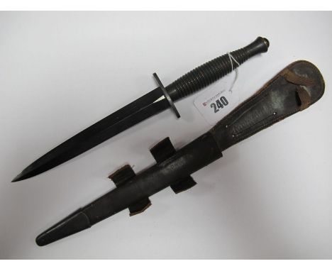 Mid XX Century Fairburn-Sykes Fighting Knife, its correct leather scabbard. 