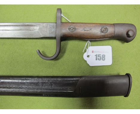 WWI British S.M.L.E Bayonet, with quillion (rare) dated 1907 by Wilkinson, in its black leather scabbard, overall very good c