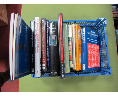 A Collection of Eleven Military Themed Hardback Books, predominantly military badges, Insignia and uniforms including Militar
