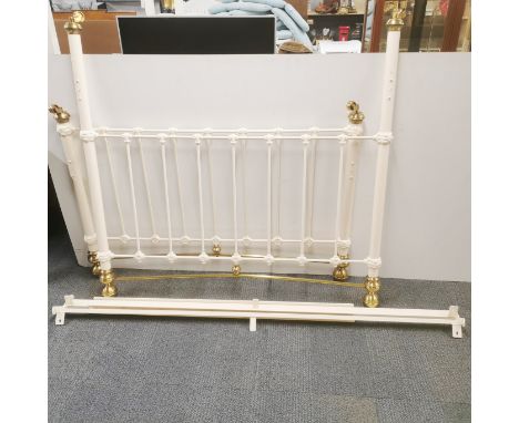 A brass double bed frame on castors, headboard 144 x 142cm.