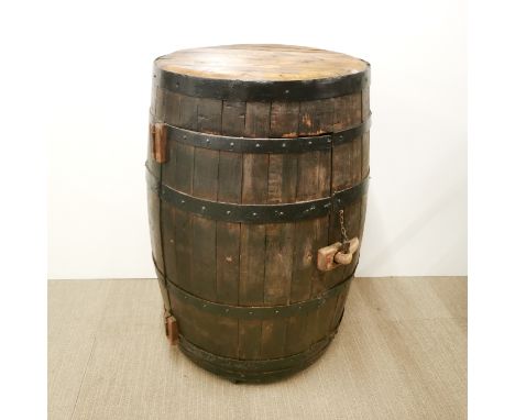 An oak and metal bound barrel drinks cabinet with shelf and lighting interior, H. 93cm Dia. 57cm.