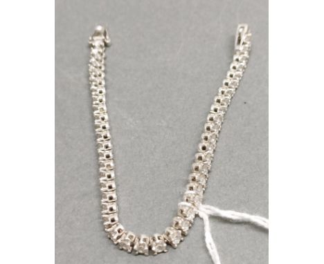 A 925 silver and cubic zirconia tennis bracelet.