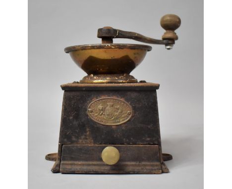 A Vintage Brass Mounted Iron Coffee Grinder by Baldwin Son &amp; Co. 