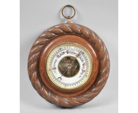 An Edwardian Circular Oak Aneroid Barometer With Rope Border, 18cm Diameter 