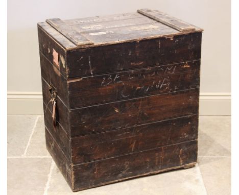 An early 20th century stained pine slatted trunk, applied with iron side swing handles, and hand tied printed card label 'Orm