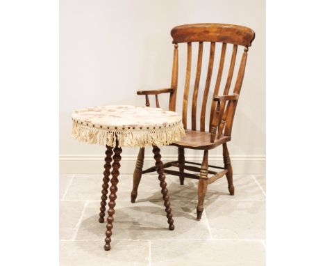 A Victorian elm and beech wood Windsor farmhouse elbow chair, the curvilinear lath back over a shaped and figured elm seat, r