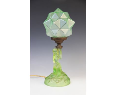 An Art Deco green glass table lamp by Walther & Sohne, early 20th century, modelled as a nymph on a rocky outcrop supporting 