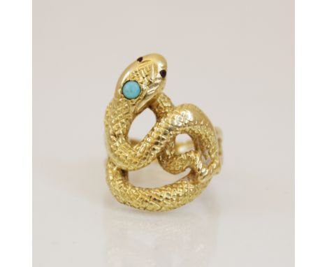 A continental 18ct gold turquoise and ruby set snake ring, the coiled body with engraved decoration, turquoise cabochon set t