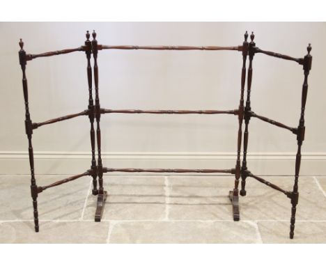 A George III mahogany gate folding clothes airer, with urn shaped finials upon a ring turned and ring incised frame, supporte