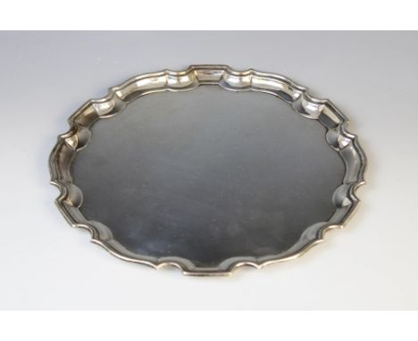 A George VI silver salver by Deakin &amp; Francis, Birmingham 1941, of plain polished circular form with Chippendale border, 