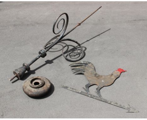 A weather vane modelled as a cockerel, of typical form, the wrought iron stand with tri-form scrolls to the base, the cockere