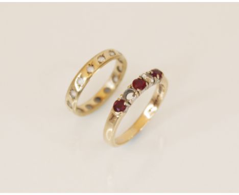 A ruby and diamond 9ct gold ring, comprising three round mixed cut rubies and a round brilliant cut diamond, claw set to a pl