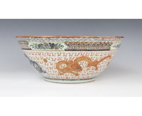 A Chinese porcelain Cantonese rose bowl, 19th/20th century, decorated in rouge-de-fer palettes with conforming dragons and fl