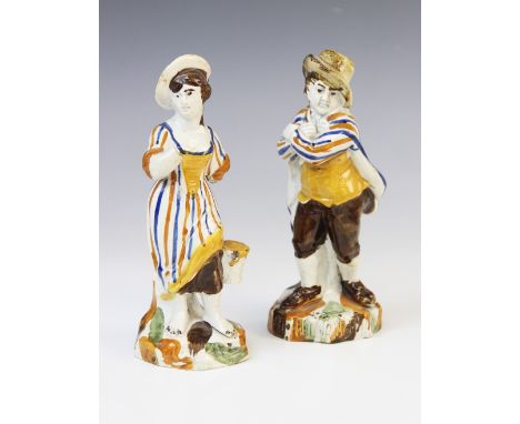 Two Pratt Ware figurines, early 19th century, one modelled as a woman collecting harvest into a basket (representing summer),