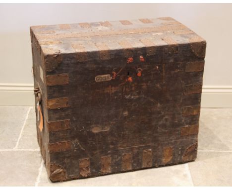 A 19th century stained pine and metal bound trunk, label verso 'R & S Garrard & Co, Panton Street, London', applied with side